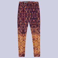 Flat front view of DESTINY statement gold copper leggings with butterfly wings pattern