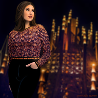 Front-left view of plus size model wearing DESTINY gold copper long sleeve tight fit crop top at a desert festival at night